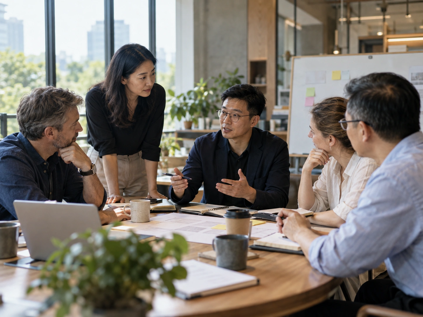 Professionals discussing strategy in a contemporary meeting environment