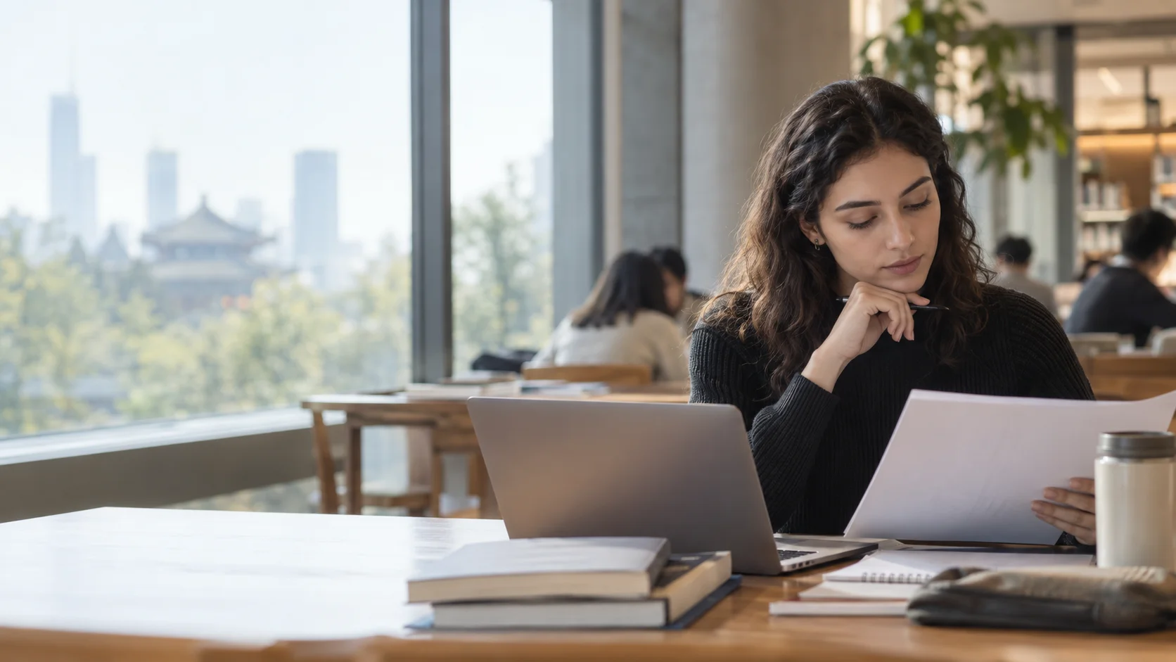 International student reviewing study information at a quiet desk